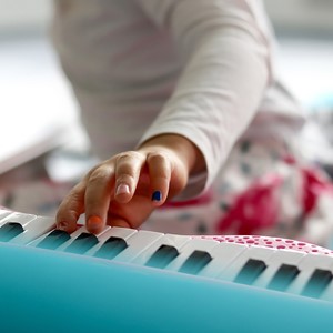 Toddler playing keyboard